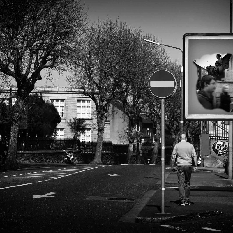<p>During the Covid - 19 First Lockdown in Dublin City, Ireland. A man passes by a virtual image on an advertising billboard, in an empty city street.</p><p>Images from Eamonn Farrell's The Naked City Virtual Exhibition for Dublin Culture Night 2020.</p>