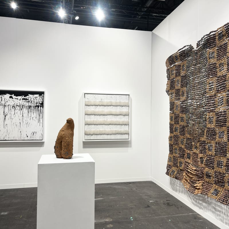 View of AFIKARIS Gallery's booth at Art Genève featuring works by Mouhcine Rahaoui, Ozioma Onuzulike and Salifou Lindou