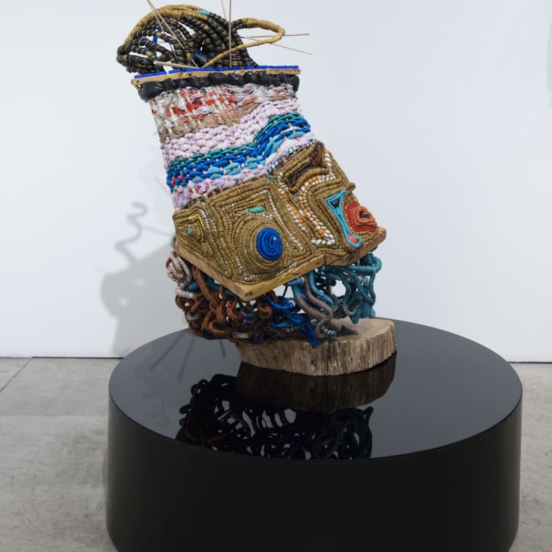 Ifeoma U. Anyaeji Ókpókóló éjùnà (Snail shell) 2023 Repurposed discarded non-biodegradable plastic bags (Plasto-yarns) and bottles, found wood, twine, metal wire, found objects, and plexiglass 125 × 120 × 132 cm