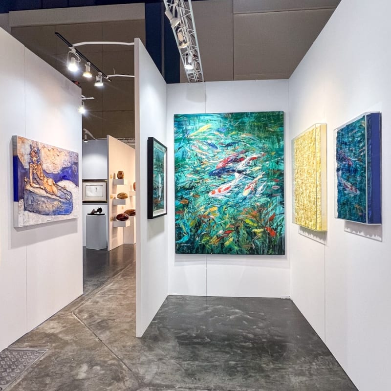 Paintings displayed at Carousel Fine Art's booth at the Palm Beach Show art fair, 2023.