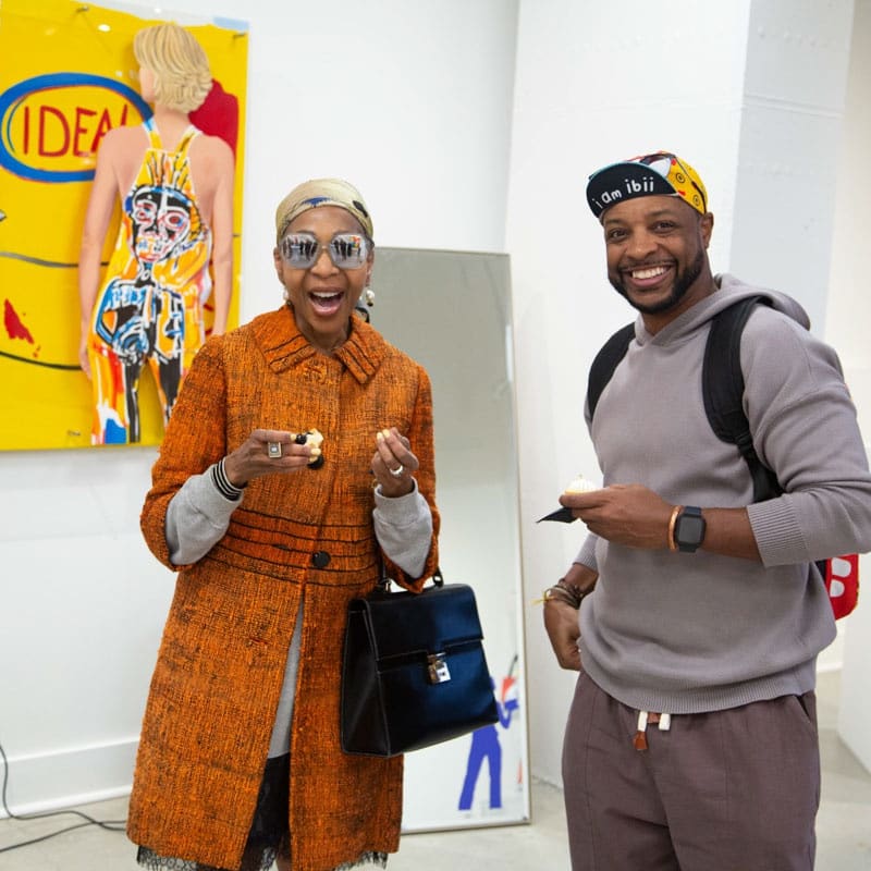 People at Carousel Fine Art's gallery space in Buckhead Village, Atlanta during the Caroline Dechamby Retrospective.