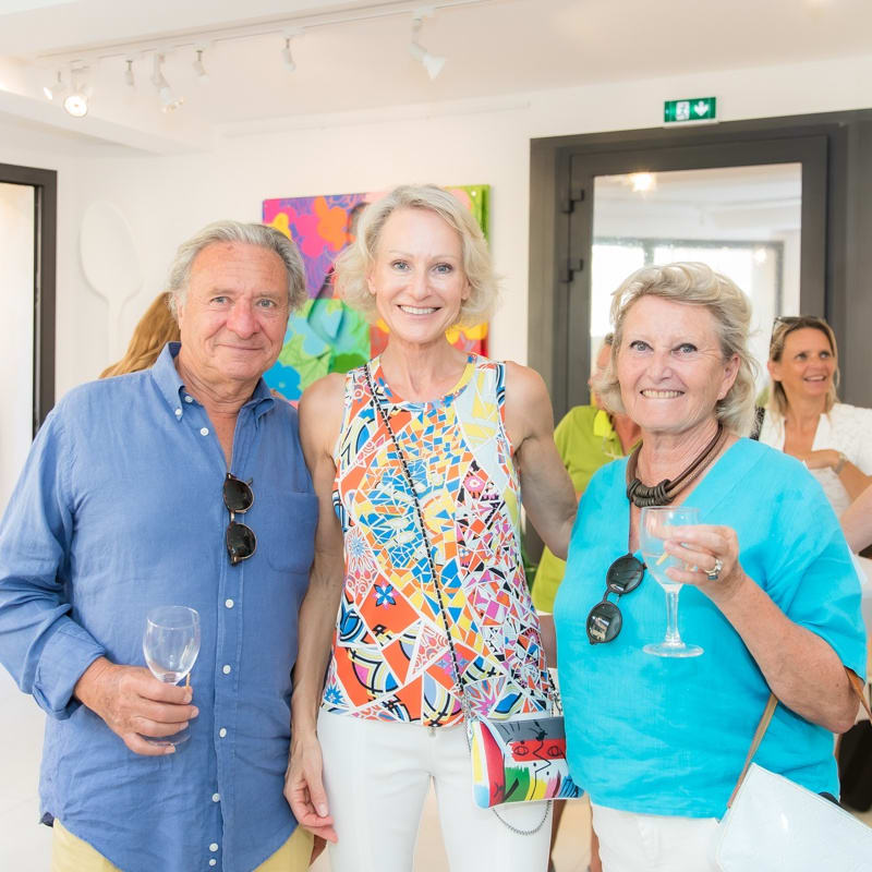 People inside of Carousel Fine Art's gallery space in Saint Tropez.