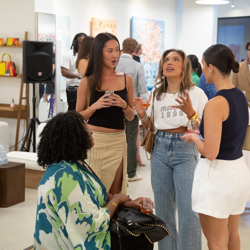 People in Carousel Fine Art's Buckhead Village location during the Eric Alfaro exhibition "Spring Reverie."