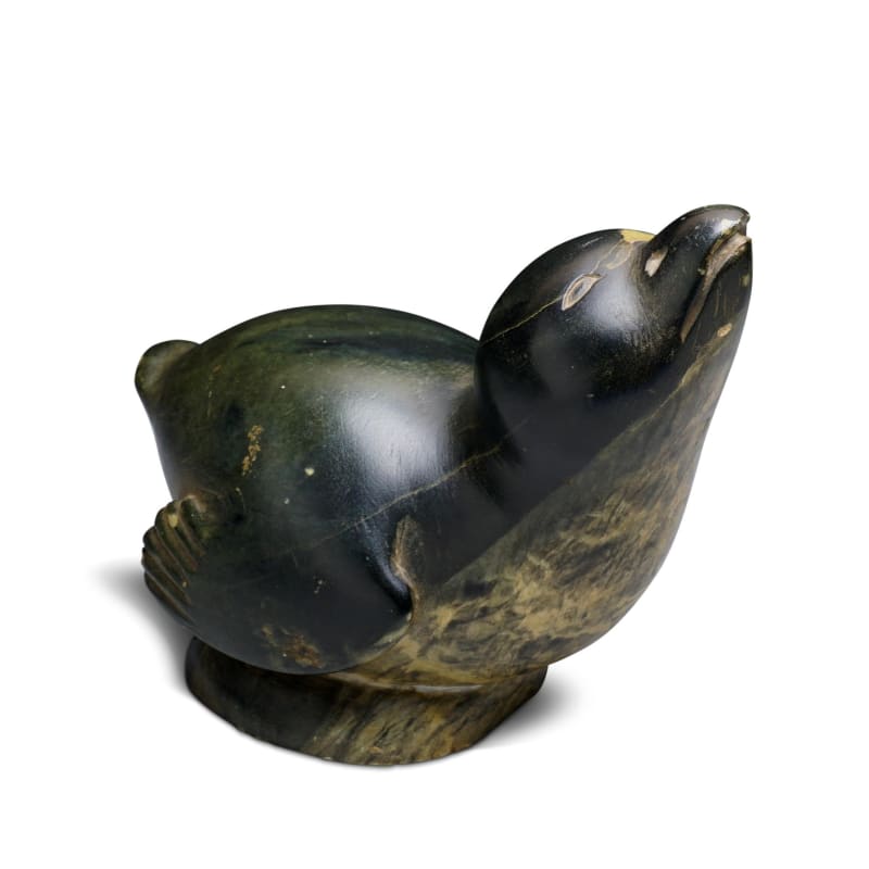 LOT 1  HENRY EVALUARDJUK (1923-2007) IQALUIT (FROBISHER BAY)  Bird with Raised Head, c. 1963  stone, 4 1/2 x 2 1/2 x 3 1/2 in (11.4 x 6.3 x 8.9 cm)  ESTIMATE: $1,500 — $2,500  PRICE REALIZED: $1,440