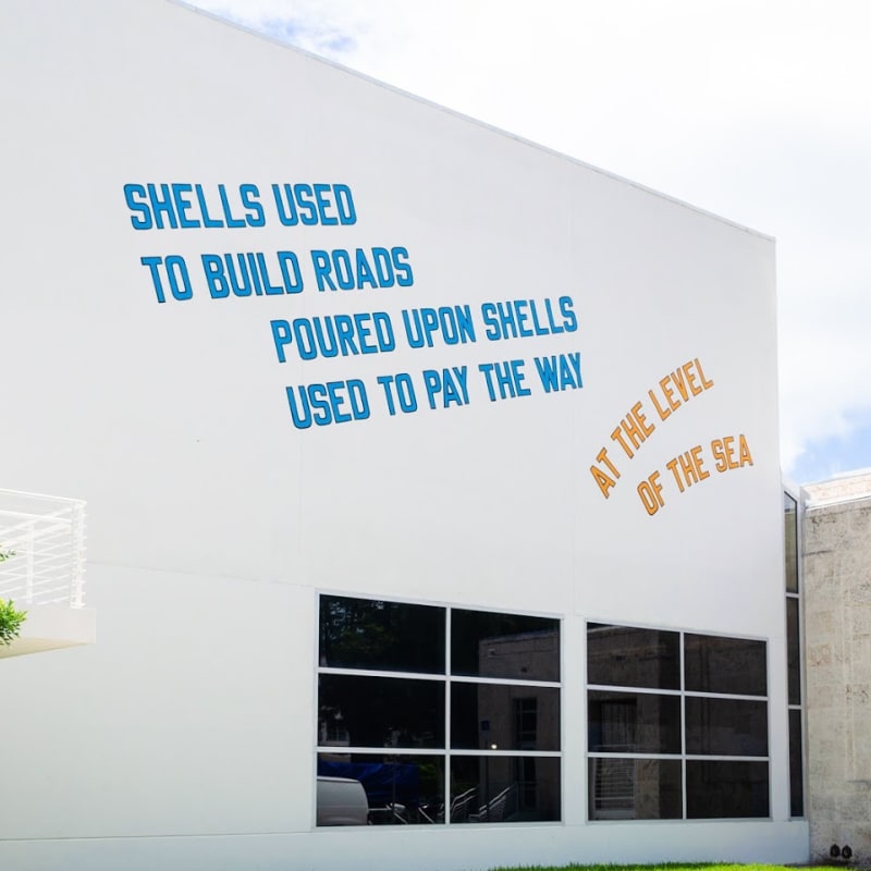 Image: Lawrence Weiner, SHELLS USED TO BUILD ROADS POURED UPON SHELLS USED TO PAY THE WAY, AT THE LEVEL OF THE SEA (2008) © Lawrence Weiner. Photography by Zaire Kacz