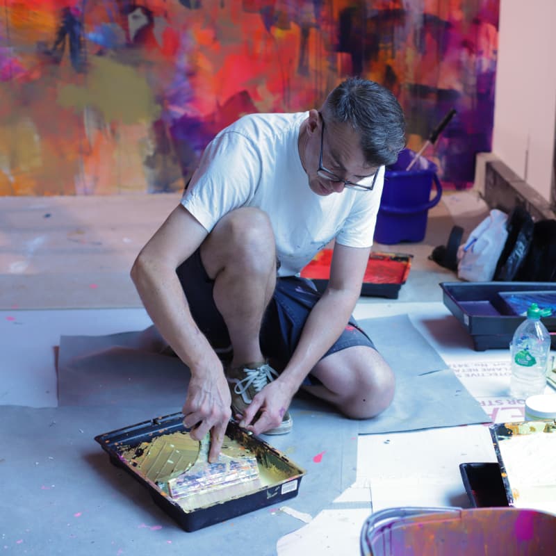 Mr Jago painting a two storey mural in Shoreditch, 2018