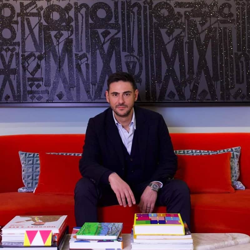Mario Zonias, Co-Founder of Maddox Gallery sits in front of an original RETNA painting, as he explains how to sell high end art.