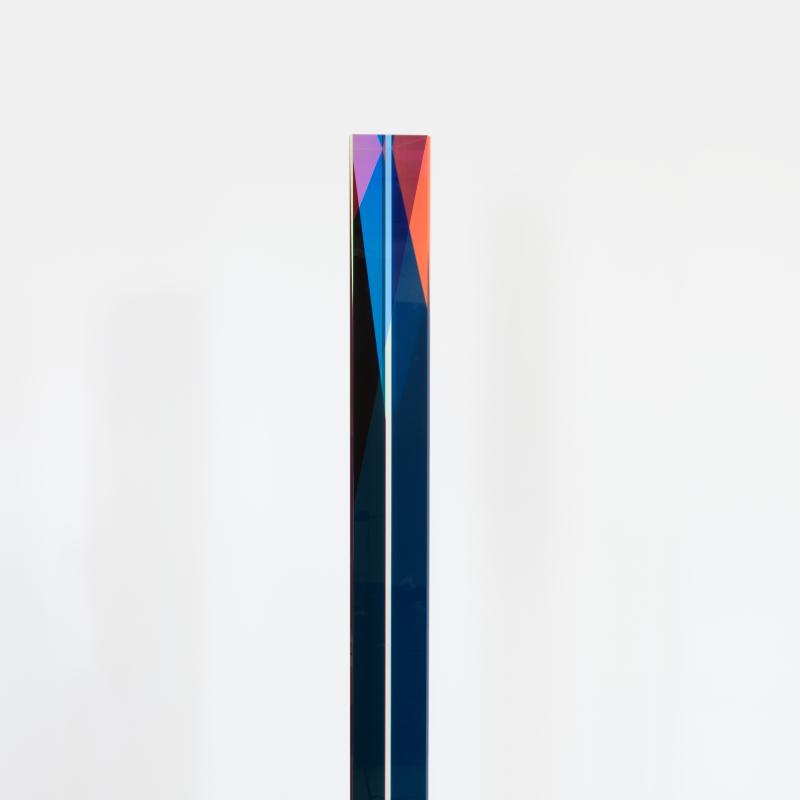 A tall narrow form constructed of colorful acrylic