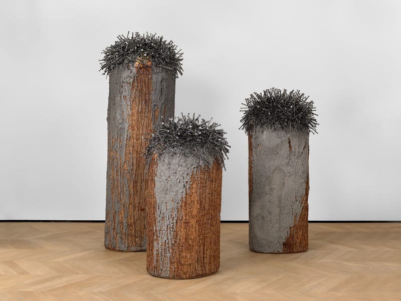 Günther Uecker Bäume aus einem Stamm (Trees from One Trunk), 2009-2015 Painted nails with ash and glue on wood Tallest element: 80 11/16 inches high x 31 1/2 inches in diameter 205 x 80 cm Middle element: 59 inches high x 31 1/2 inches in diameter 150 x 80 cm Shortest element: 51 3/16 inches high x 29 1/2 inches in diameter 130 x 75 cm