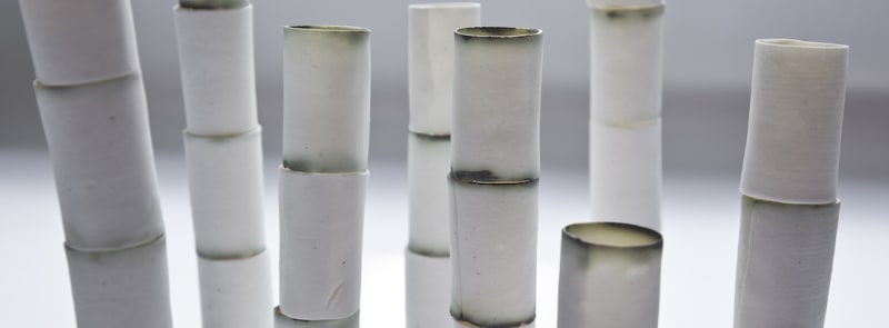 Valéria Nascimento Bamboo Installation Porcelain with copper oxide on walnut base 61 x 59 x 9 inches overall