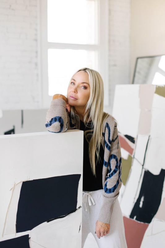 Artist Holly Addi with her 2022 Fall Collection of paintings