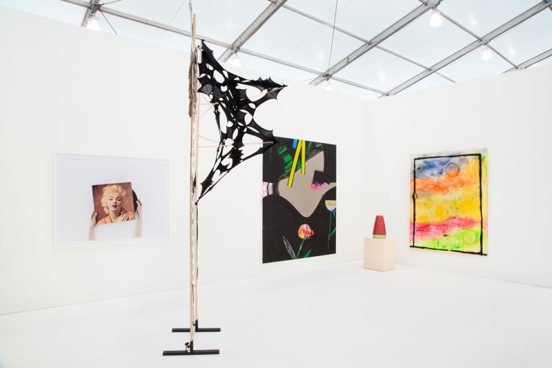 Group booth installation with gallery artists, including Anne Collier photography and Lara Schnitger's sculpture.