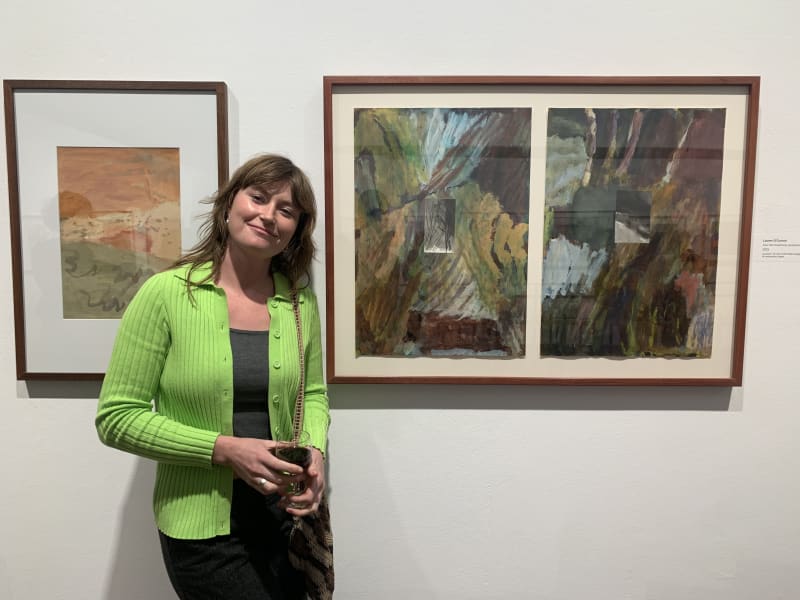 Lauren O'Connor with her work eyes half closed/gang gang/dried up creek bed at the FLOW National Contemporary Watercolour Prize