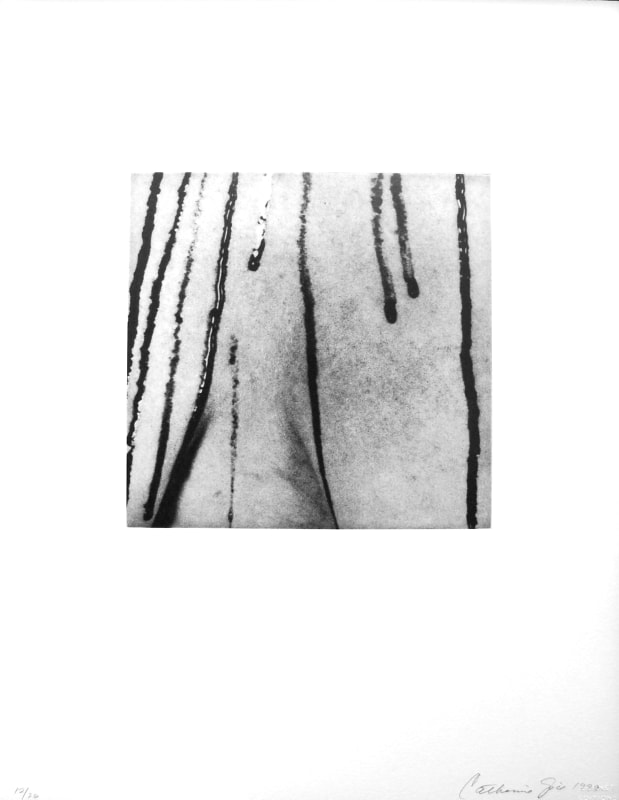 Close-up black and white image of blood trickling down a patch of skin