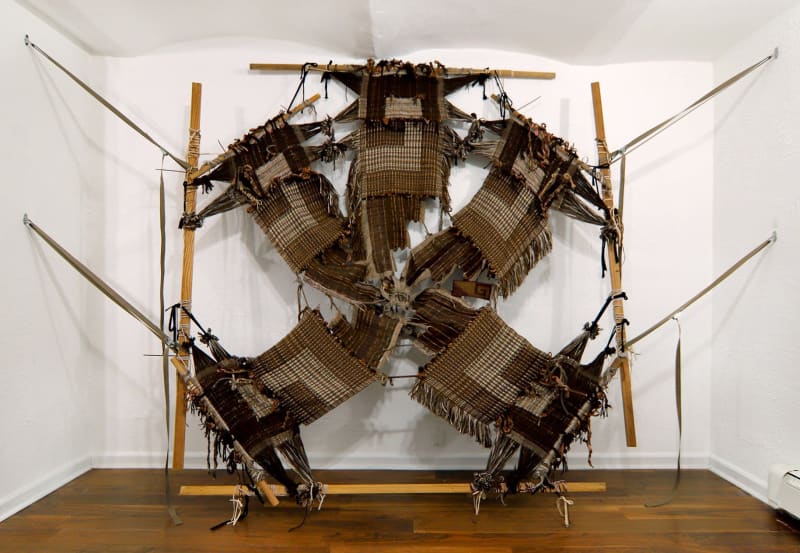 Kira Dominguez Hultgrens “Colita de Rana or Zip Ties” (2022), in which five separate burlap-colored panels meet in a loose knot at the center. Kira Dominguez Hultgren and Heroes Gallery