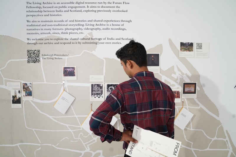 Examining the Living Archive display in the 'From Where I Stand' exhibition