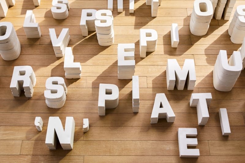 An installation by Melik Ohanian, "One Minute and Two Seconds – Jean-Luc Godard’s voice recording", 2008. 678 plaster letters, 12 LP vinyl record, Varying sizes. Courtesy Lovell Art Advisory. Photography by Eric Piasecki