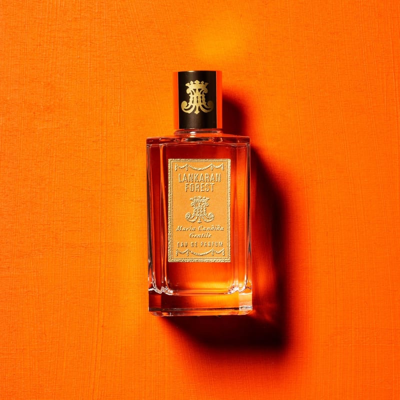 Perfume bottle LANKARAN FOREST by Maria Candida Gentile against and orange background