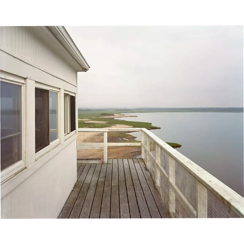 Adam Bartos Art Barge (178), July 2018 photograph showing an image of a building looking out over shallow water and a shoreline.