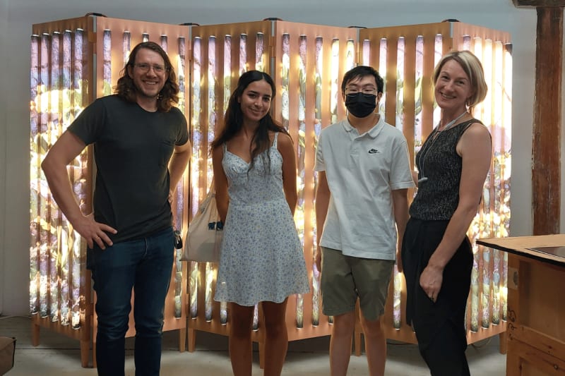 Mentees Ana Hernández and Michael Sun with curatorial mentor Jen Mergel at a studio visit with artist Clint Baclawski