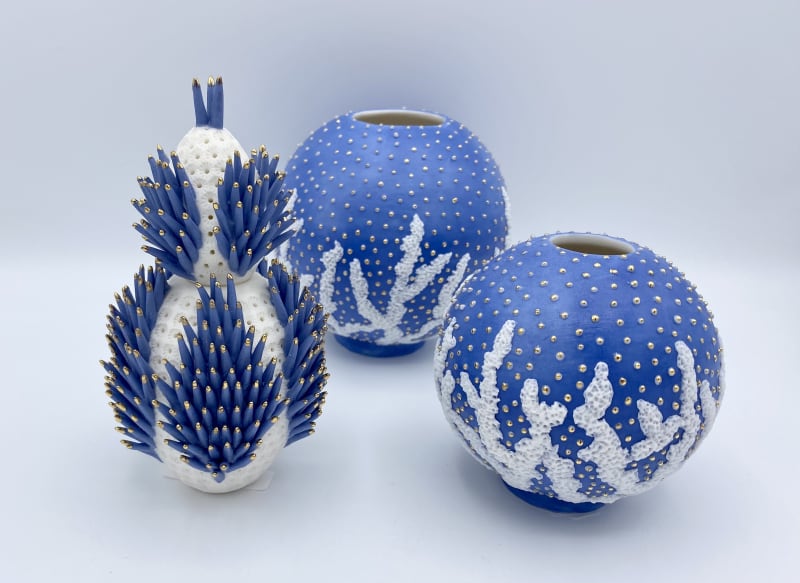 Delfina Emmanuel Spikey Blue Egg, 2020, Parian Clay with blue spike with gold, Blue Moon Jar's - Bleached Coral, 2023, Parian porcelain, lead glazed with gold lustre.