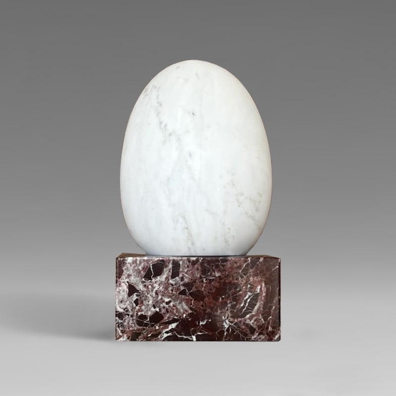 Marble egg on pedestal by Curie Adelswärd