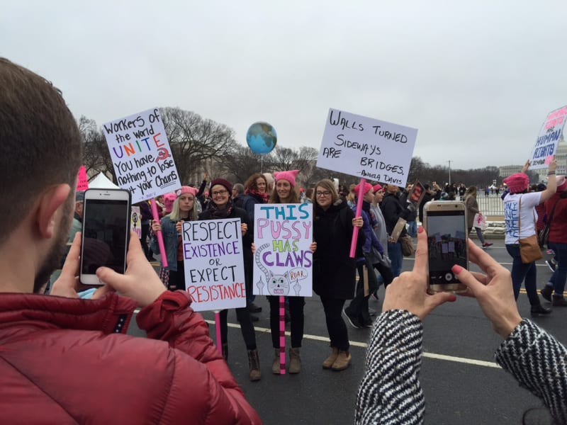 Photograph of protestors at the women's march holding up various signs critical of Trump, Washington, D.C., Jan 2017