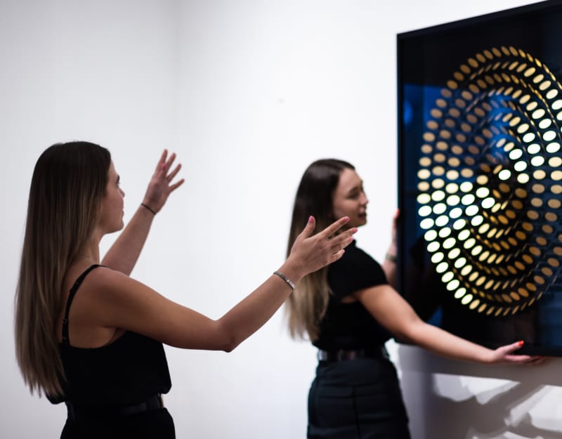 Lana Gormley and Isobel Carnegie installing a Peter Monaghan artwork