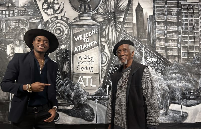 Fine artist Raphael Bahindwa with Acclaimed Atlanta-based photographer Jim Alexander. Photo by Noah Washington/The Atlanta Voice