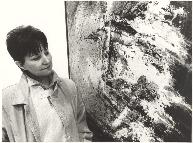 Juana Francés in front of one of her artworks.