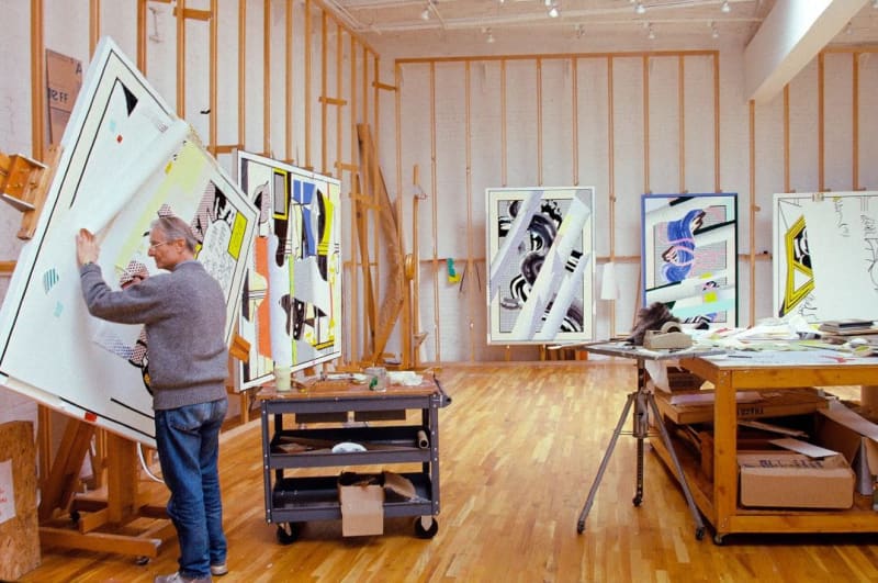 Photograph of artist Roy Lichtenstein working in a studio setting