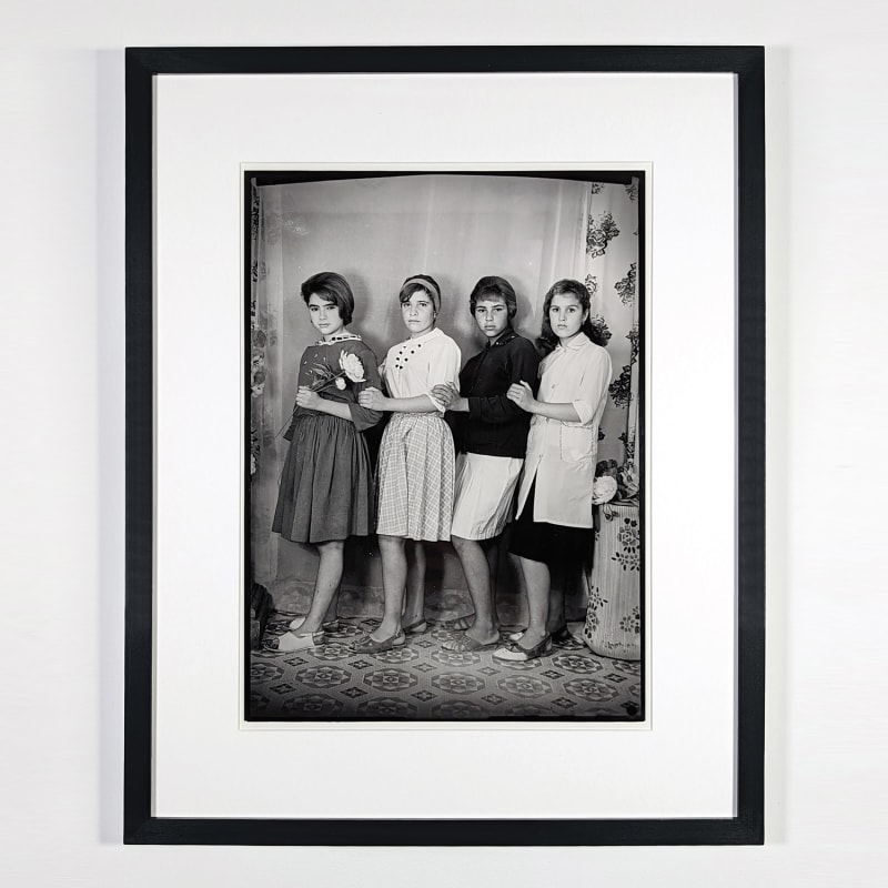 Black and white photograph of four women posing in a photo studio in Ain Beida, Algeria