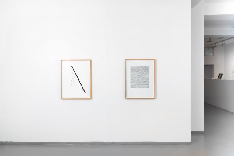 Two framed graphite line drawings by Inger Johanne Grytting hang on a white wall in a gallery like space in Oslo, Norway