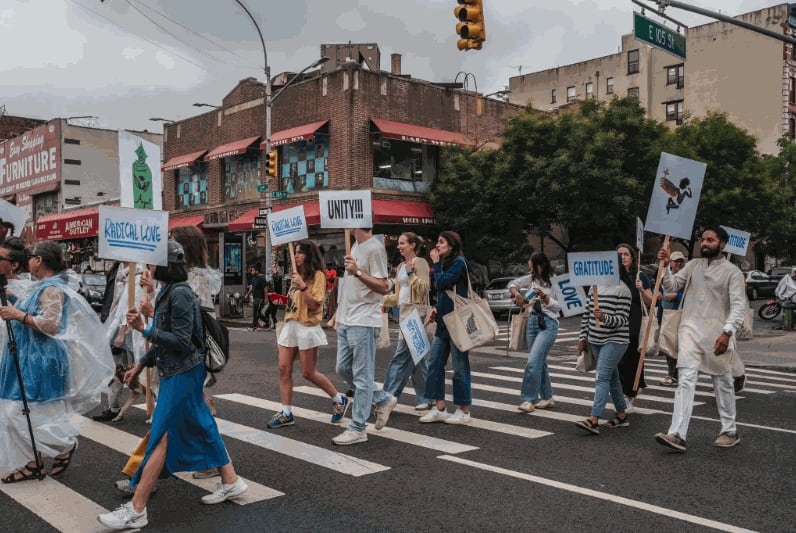 The procession stopped at multiple sites in Harlem and featured poetry readings, a musical performance and speeches about the history of the area especially its ties to Black, Cuban and Afro-Cuban life. Credit: Graham Dickie/The New York Times