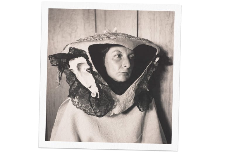 A Surrealist photograph of the painter Remedios Varo in 1957 wearing a headpiece made by her friend the artist Leonora Carrington.Credit...Kati Horna, "Woman and Mask," Ana María Norah Horna Fernández, all rights reserved. Photo via Princeton University Art Museum, Art Resource, NY.