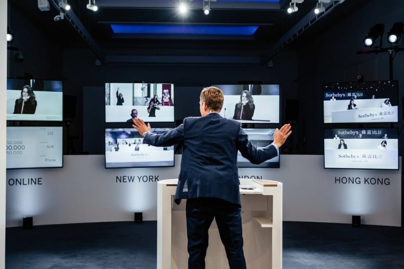 The auctioneer Oliver Barker took bids from international colleagues on screens in an empty salesroom.Credit...Julian Cassady for Sotheby’s