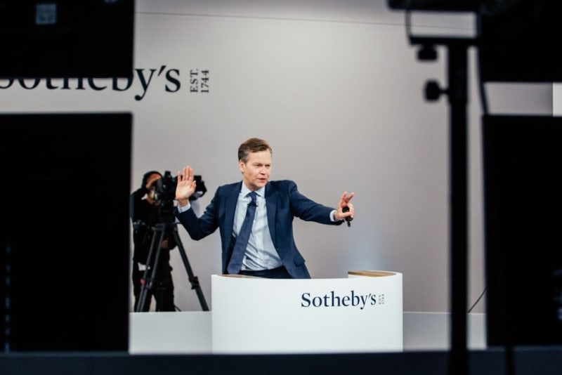 Oliver Barker in action during Sotheby’s livestreamed sale. Photo: Sotheby’s.