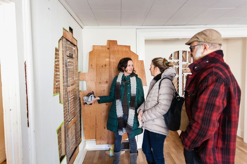 In the front parlor, an excavation by Ruby Palmer, at left, called “Reveal.”Credit...Robert Wright for The New York Times