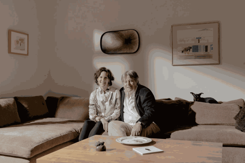 Kim and Michael McCarty at home in New York with, from left, Laura Owens’s “Untitled” (2005), a drawing and collage on paper; Tim Hawkinson’s “Advance Receding,” in oil on structured canvas; and David Hockney’s “Study for Santa Monica Blvd.” (1979), in colored pencil on paper.Credit...Daniel Dorsa for The New York Times