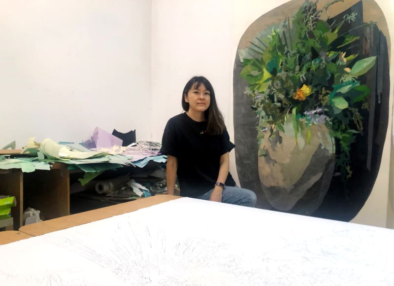 The artist with her work. Photo courtesy of Art Spiel