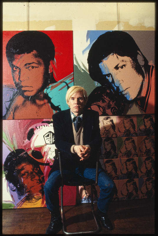 Andy Warhol in front of paintings from his 'Athletes' Series. Photo: Bernard Gotfryd | Library of Congress
