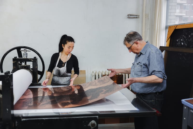 Felix Harlan and Jane Kim editioning plates by artist Didier William.