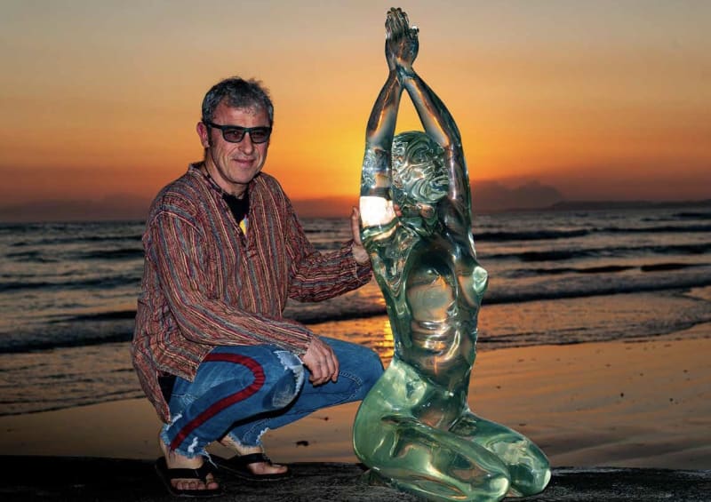 Louis Chanu next to his Flame Life Sized sculpture