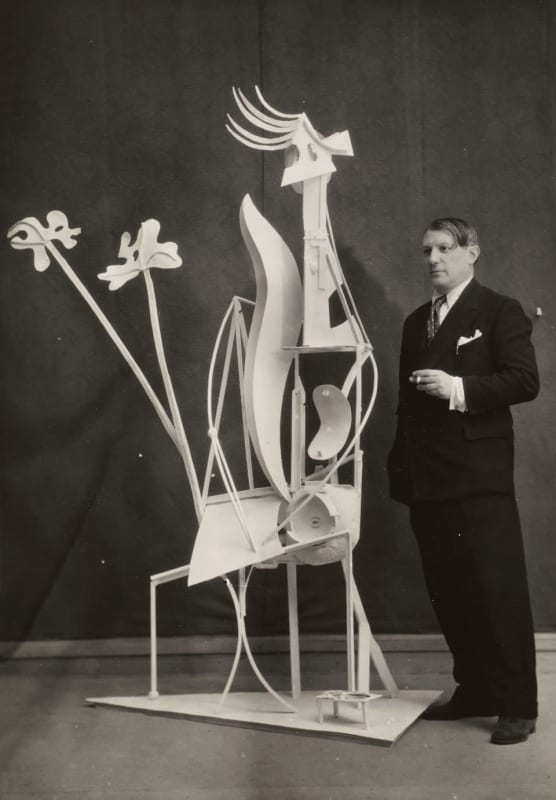 Pablo Picasso with the sculpture La Femme au Jardin, by unknown photographer, 1932
