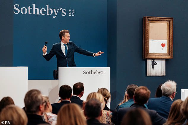 Onlookers gasped when the then-titled 'Girl with Balloon' was sucked into a concealed shredder as the hammer fell following a bid of £1.04million pounds at a 2018 auction at Sotheby's
