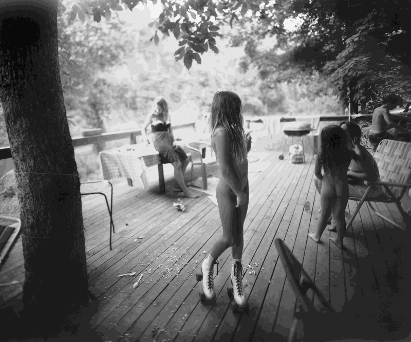 Sally Mann photograph of daughter in white skates outside