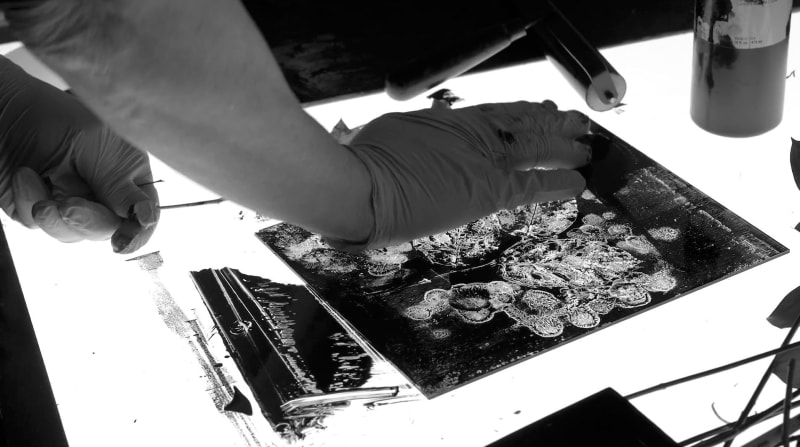 Abelardo Morell making a cliche-verre image in his studio