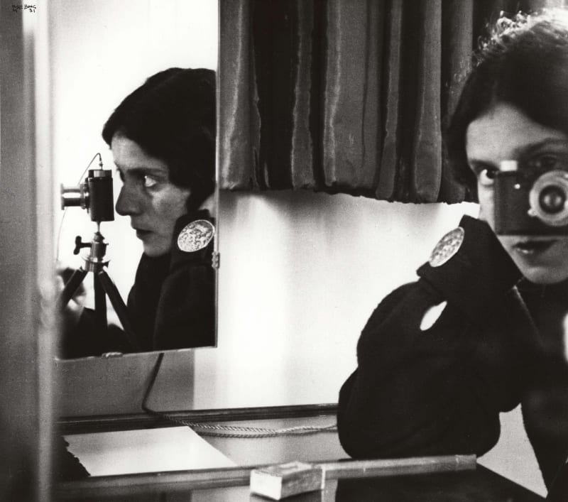 Ilse Bing making a self portrait with her Leica camera in a mirror in Paris