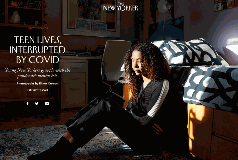 A girl on the floor of her bedroom in New York City