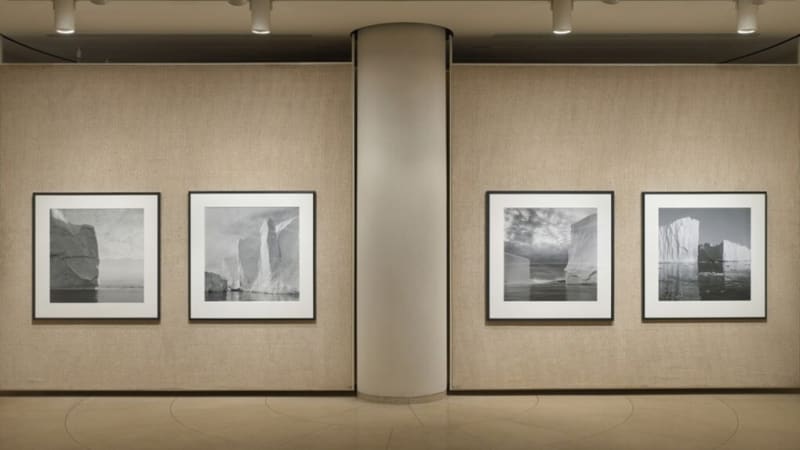 Exhibition view of four photographs of icebergs by Lynn Davis at The Glass House
